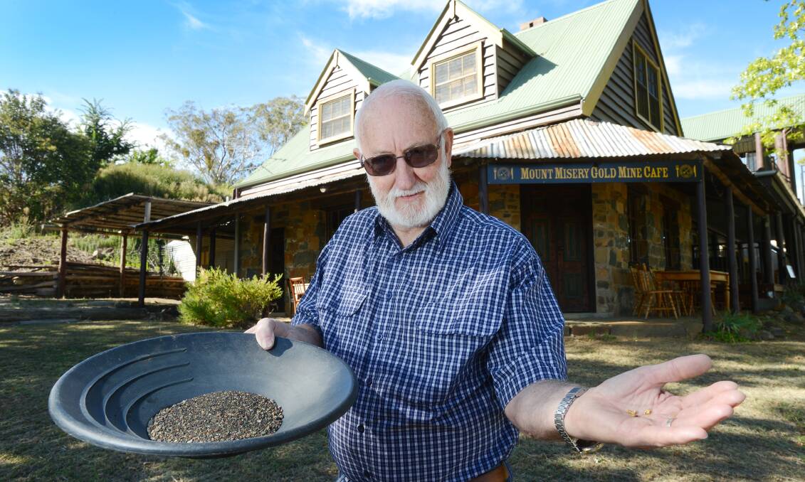 GUARANTEED STRIKE: Geoff Cummins at the Mt Misery Mine with gold pieces ready for panning during the Go For Gold Chinese Festival in Nundle. Photo: Barry Smith 120314BSA01
