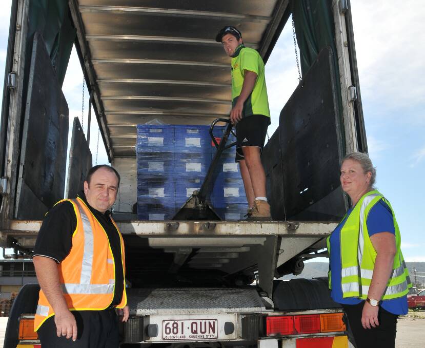 PLAYING IT SAFE: WorkCover Tamworth district co-ordinator John Ringland, 
left, with Mitch Carey and Rachel Ryan at Carey’s Freight Lines yesterday.  
Photo: Gareth Gardner 120314GGB02