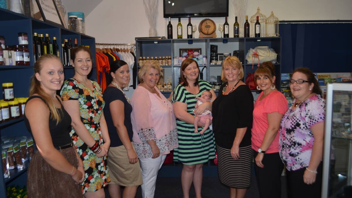 TOURISM TOPS: From left, Tourism Moree team members Maddy Brazel, Rebecca Partridge, centre manager Jaymie McDonald, chairwoman and mayor Katrina Humphries, Ashley McDonald, holding her daughter, Indy Tomlinson, CEO Tammy Elbourne, Robyn Appleby and Tian Harris. Photo: The Moree Champion