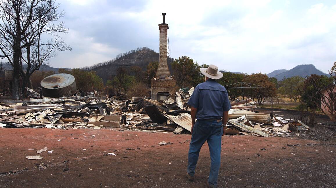 Vincent Morrisey lost his family home but his cattle survived.Coonabarabran fires.
16th of january 2013. Photo: Jacky Ghossein
