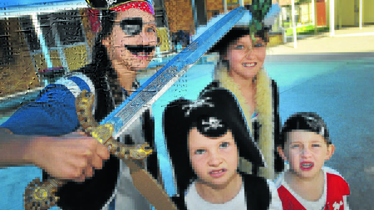 SHIVER ME TIMBERS: Moonbi Public School’s Jericho Clarke, Elsa Hudson, Taite Goodfellow and Rory Madden get into the spirit for International Talk Like a Pirate Day. Photo: Geoff O’Neill 1090914GOB02