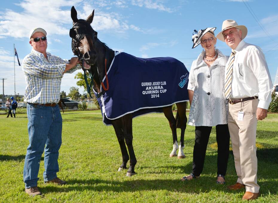 Craig Martin holds Brave Ali after his Quirindi Cup win while Cup sponsors, Lorraine and John Riley look on. Brave Ali might have missed out in the Armidale Cup but he rebounded into the winner’s box again in Doomben on Saturday. 
Photo: Barry Smith 210214BSE31