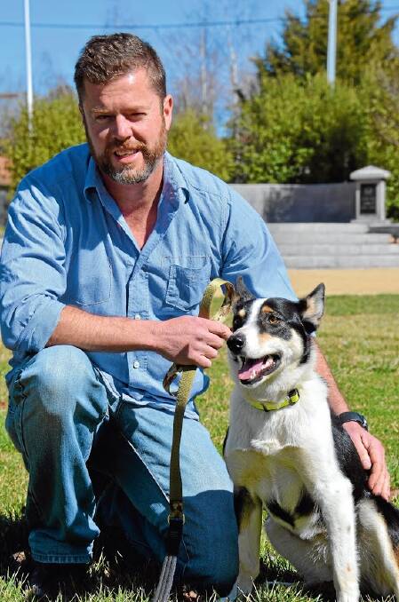 SOLDIERING ON: Army veteran Murray Young with companion-dog-in-training Rosie. Photo: The Glen Innes Examiner