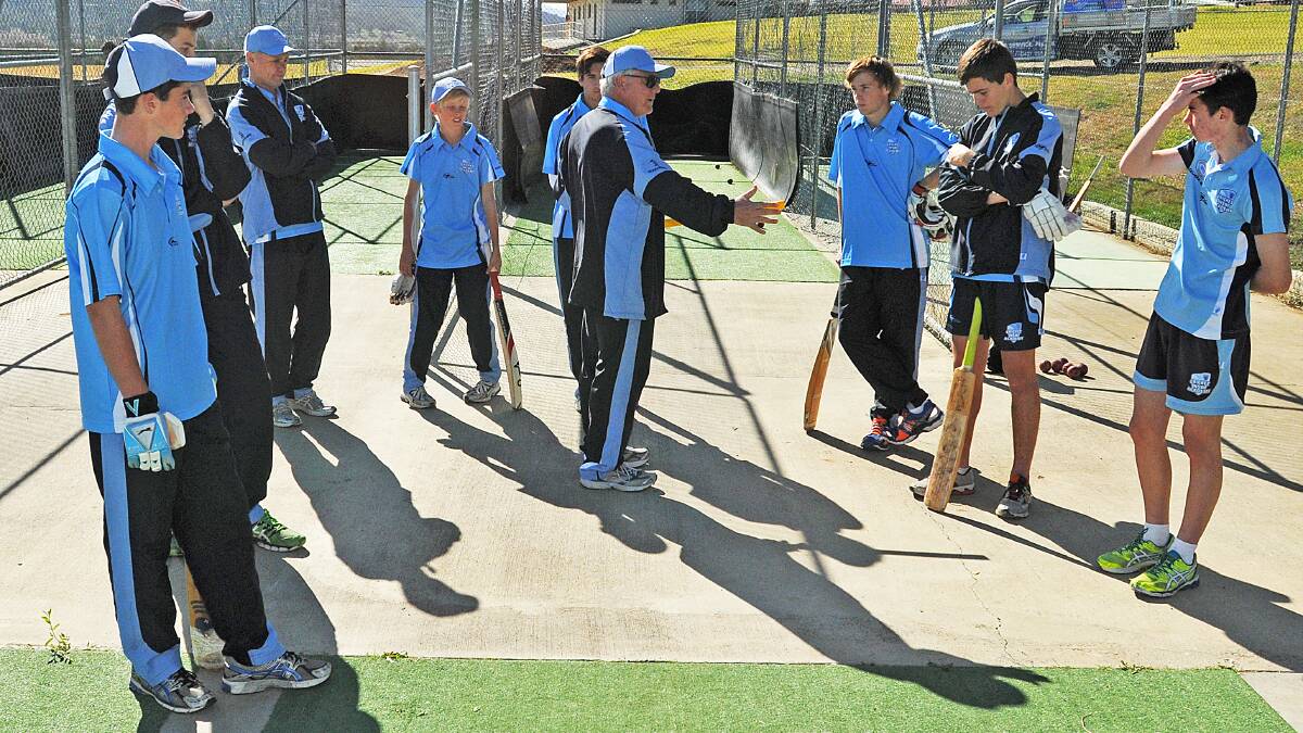 Former NSW Country top order bat Terry Browne (centre) explains a few batting tips to some of the CNZ academy squad members at the weekend camp. Photo: Geoff O’Neill 120714GOC01