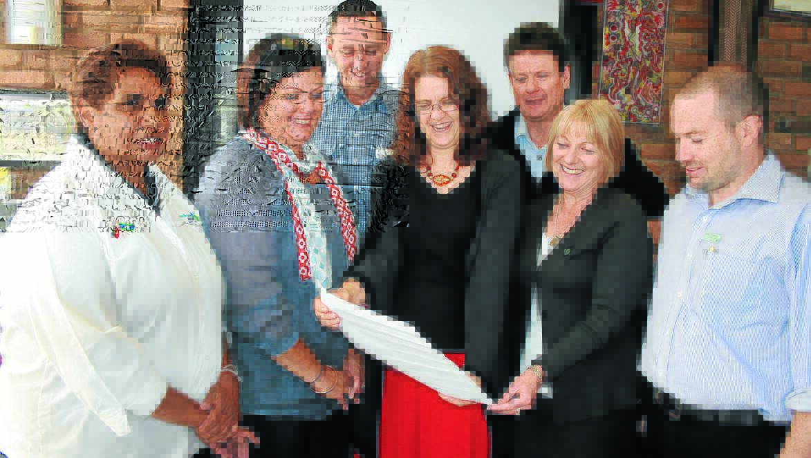 COMMUNITY SUPPORT: From left, New England Medicare Local staff Nellie Blair, Peta Waters, Peter Collins and Therese Greenlees, Guyra Shire Council general manager Peter Stewart, New England Mutual Guyra branch manager Sue Young and New England Mutual area manager Dane O’Connor.