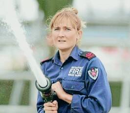 FIREPOWER: Di Gallagher from Tamworth NSW Fire and Rescue shows her form during the regional firefighting championships.