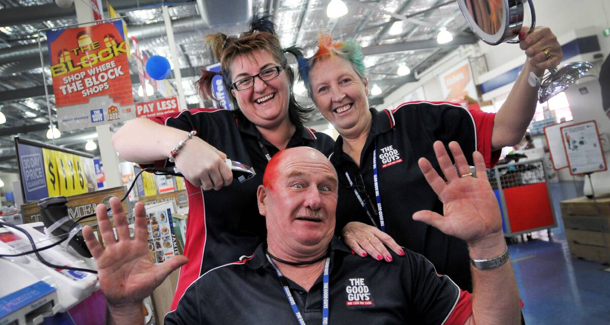 IN LIVING COLOUR: Good Guys Tamworth proprietor Kathy Webb takes the clippers to staff member Colin Brooks while Julie Dawe positions the mirror. The store will hold a special head-shave fundraising event this weekend.
Photo: Gareth Gardner 040314GGA04