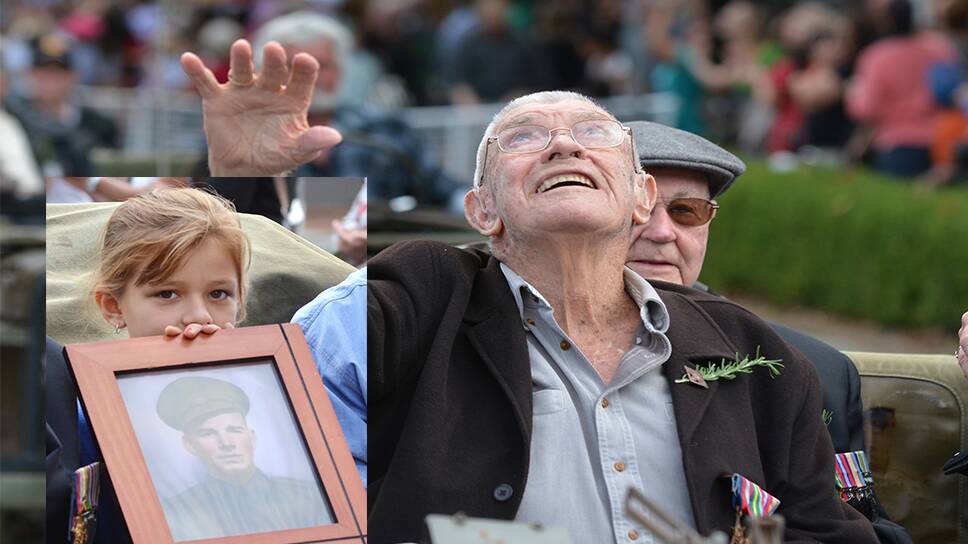 SALUTING HIS MATES: War veteran Charles Nunn looks to the heavens during the Tamworth Anzac Day parade yesterday. Photos: Barry Smith 250414BSA011 INSET – Taylor Jobson, 8, carries a photo of her great-grandfather Arthur Jobson during the Peel St march. 250414BSA041