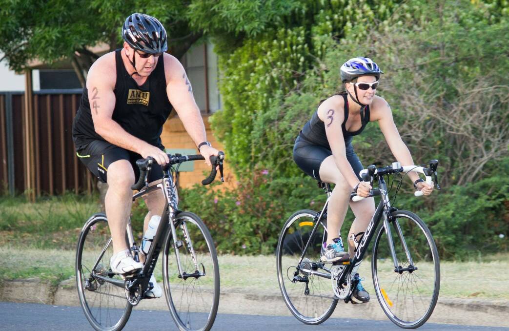 Paul Day and Susie Coombes race the bike leg during the Tamworth Triathlon Club’s 
season-opening race on Saturday