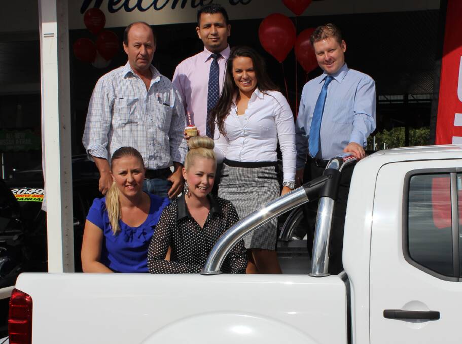 FIRM FARM FRIENDS: NSW Farmers rep Stewart Murdoch, back left, with Fossey’s staff Mark Arora, Phebe Urquhart and Phil Bartlett, and, front, Karina Jenkins and Casey Renolds are in party mood for the Nissan sales specials.