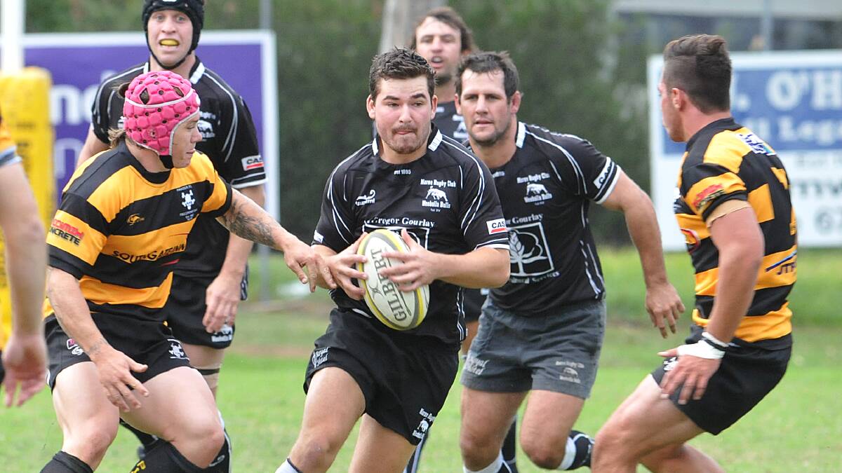 Moree centre Jordan Cosh tries to find a hole in the Pirates defence when they met five weeks ago but is closed down by Jake Douglas (left) and Michael Carr (right) as Ben Colley looms in support.  Photo: Geoff O’Neill 100514GOH02