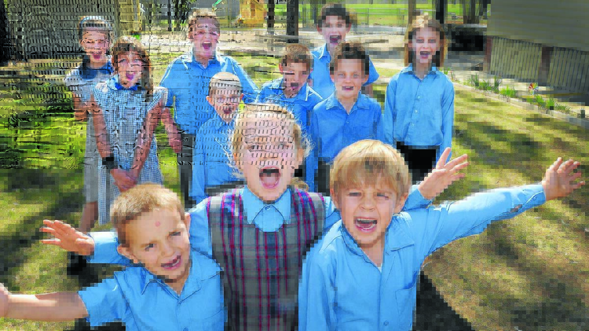 ON SONG: Somerton Public School students warm up their vocal chords for Music: Count Us In next month. Front, from left, Brendan Mitchell, Annie Hook, and Nicholas Hook, and back from left, Tiara Markwick, Tiarna Harrison, Andrew Harrison, Jack Drew, Shannon Mitchell, Ben Gardner, Benny Markwick and Jessica Wayman. Photo: Geoff O’Neill 170914GOA01