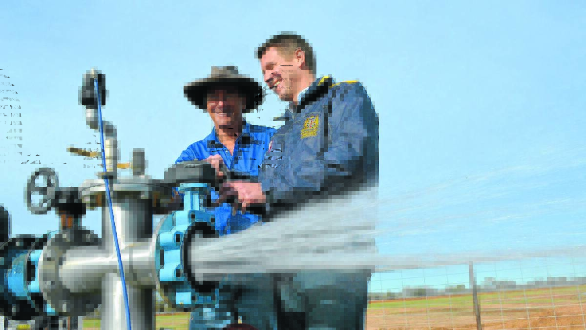 DROUGHT-PROOFING: Ed Fessey from Bullabelalie, Weilmoringle, with a bore drilled under the Cap and Pipe the Bores program. Photo: Ruth Caskey, The Land