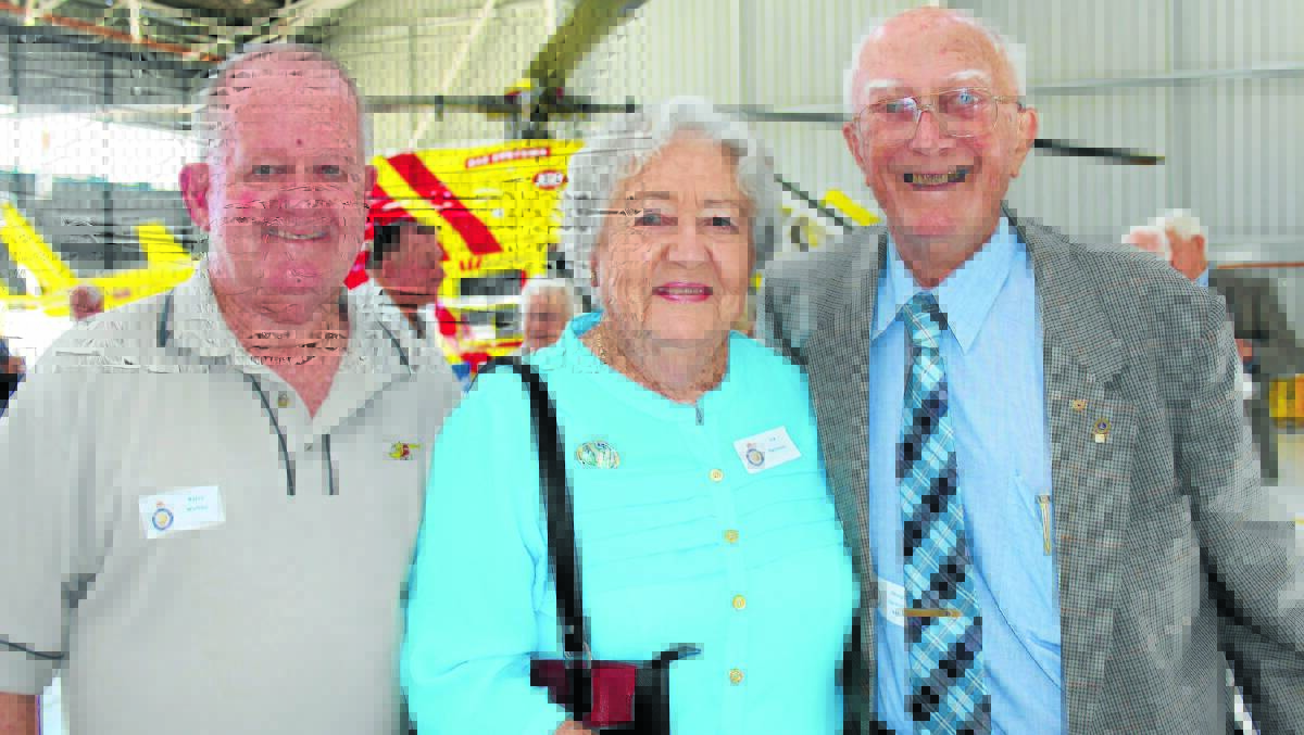 EYE-OPENING: Westpac Rescue Helicopter Service chief Barry Walton, left, takes Iva and Doug Harbison on a tour of the hangar at Tamworth Airport.