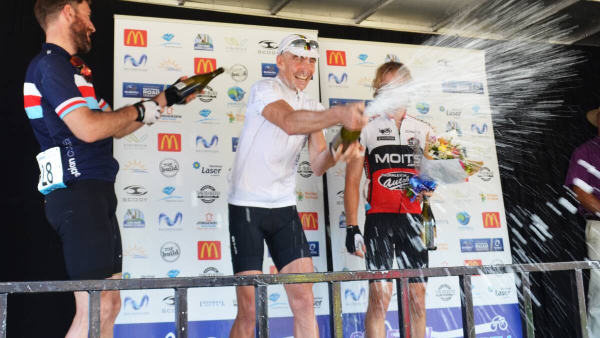 Unleashing the champagne at the presentation of C Grade are ( from left) Simon Anderson, Brett Newton, and Jacob Patterson. Photo: Chris Bath 251014CBA57