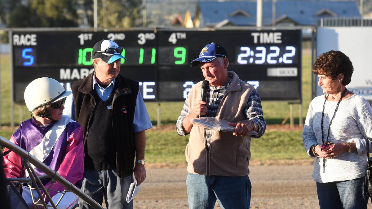 Kootingal trainer Ian ‘Spud’ Verning extols the virtues of Alyeska Dream and young driver Tom Ison (left) during Thursday’s presentation ceremony at Tamworth Paceway. Club director and deputy chairman Mark Lowe (left) looks on with Bev Cloake (right).
Photo: Gareth Gardner 070515GGG05