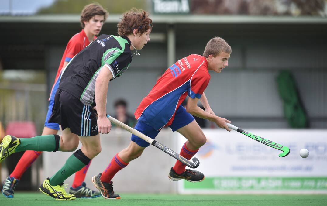 Harper Galvin juggles the ball for South against Kiwis recently. Galvin yesterday helped jag his McCarthy U16s side an important win in their final game with two goals. Giving chase is Matt Sing. He’s been away with the North West side all week. Photo: Barry Smith 170515BSF16