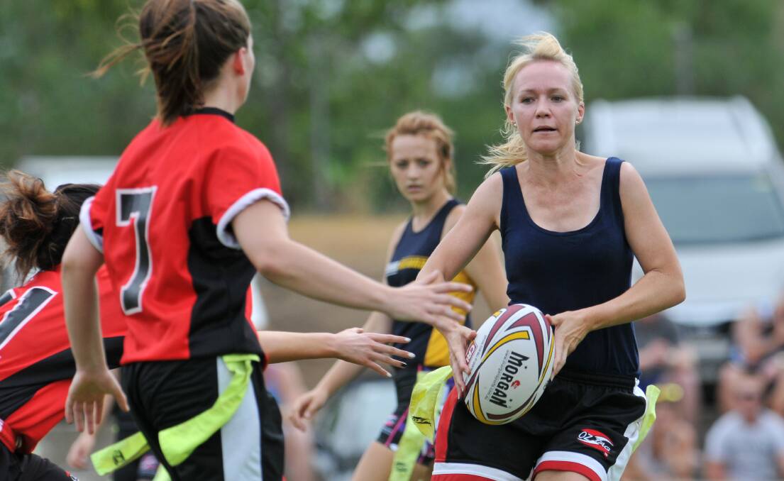 Oxley DIggers’ Rachel Schmiedel takes the ball to the North Tamworth defence during Saturday’s Ladies League Tag trial.  Photo: Gareth Gardner 150214GGE03