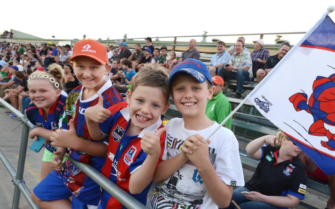 KNIGHTS WIN: Young Newcastle Knights fans, from left, Chloe Marsh, 11, Kyle Marsh,15,  from Beresfield, with  Martin Hatton, 7, Jack Hatton, 8, from Wee Waa cheered on their team to a win. Photo: Barry Smith 220214BSI02