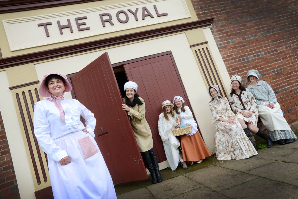 THEATRE PLAY: Secretary Maryellen Scanlon accompanied by Robyn Roseby, eight-year-olds Ella Hobson  and Arabella Scanlon, Jodie Thompson, Sam Wearne and chairperson Nic Hoy in all their period finery. Photo: Barry Smith 260714BSC09