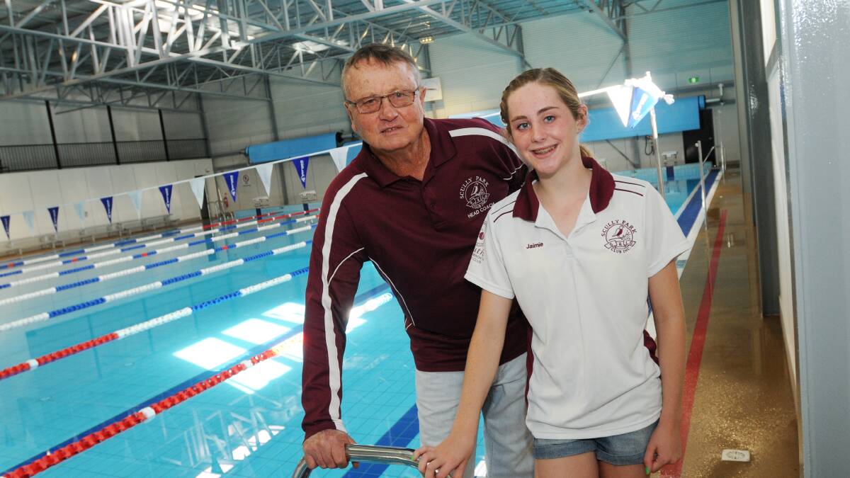 Scully Park Swimming Club coach Brian Watson and nationals-bound Jaimie Prendergast at 360 Fitness and Gym 
yesterday. Photo: Gareth Gardner  160414GGG01