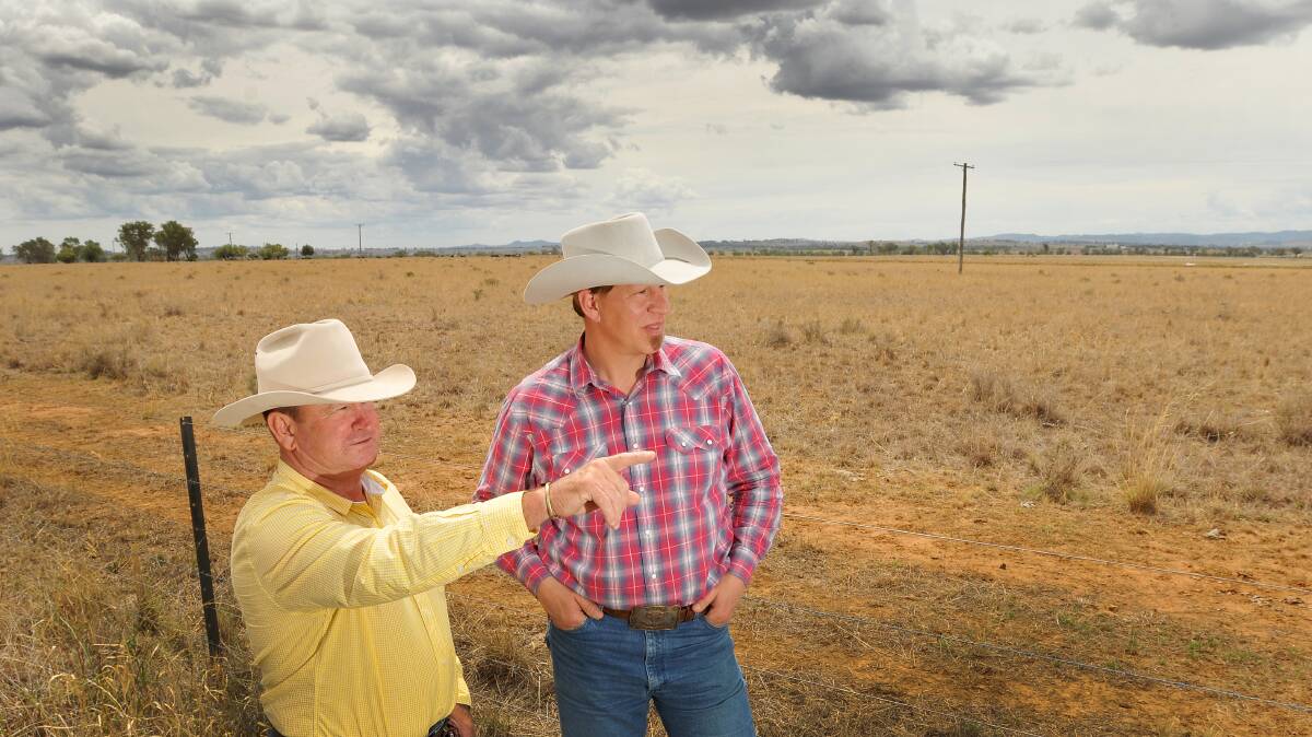 BEWARE: Anti-coal seam gas campaigner David Quince shows visiting US rancher John Fenton around the region. Mr Fenton, who claims coal seam gas extraction ruined his family’s farm in Wyoming, has urged locals to fight Santos’s plans for the Pilliga. Photo: Gareth Gardner 260214C02