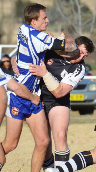 It was a quet day at fullback for Barraba’s Kahlan Duncan at home but he still found time to show Werris Creek winger William Duff the ball in the 58-6 win.  Photo: Christopher Bath 120714CBA12.