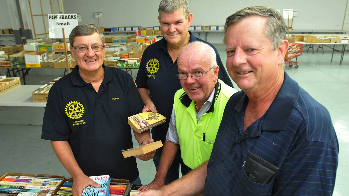 ARRANGING: Tamworth Rotary Club volunteers, from left, Steve Beaton, John Nash, Ken Hall and Max Hogg begin the mammoth task of categorising 
thousands of books in readiness for next month’s annual book sale. 
Photo: Geoff O’Neill 080414GOD01