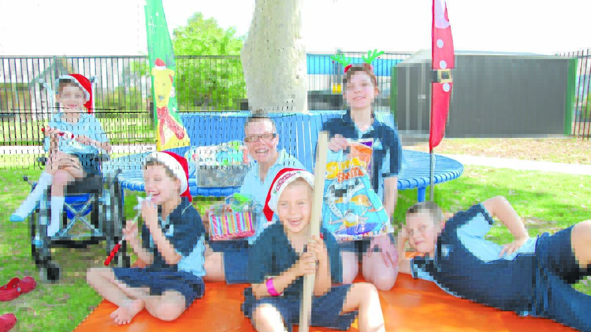 CELEBRATION TIME: From left, Lachlan Beaton, Angus Webb, Kate Simon, Thomas Dunn, Tiffany Ellis and Tyler Downey can’t wait for the twilight boot sale.