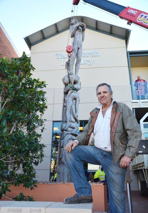 NEW ADDITION: Sculptor Stephen King with his work Stargazer, which was installed outside the gallery and library building yesterday. Photo: Barry Smith 080514BSA04