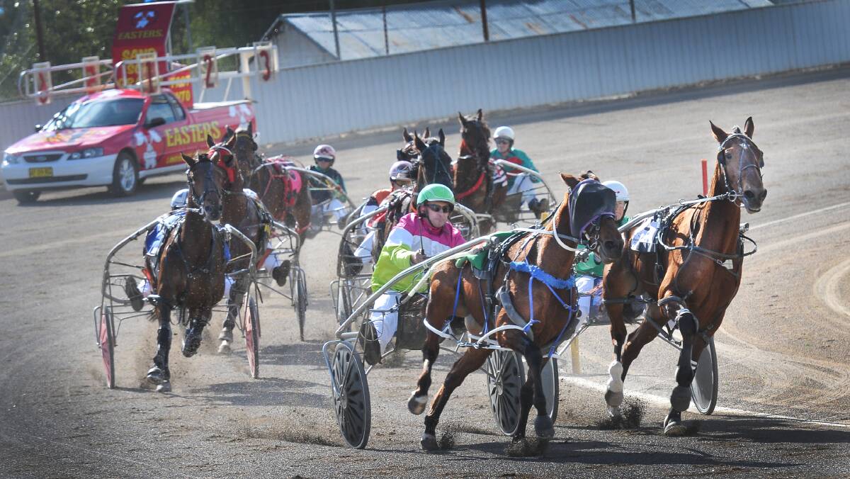 Stunin Art (left) and Cocky’s Fancy lead into the straight in a race where Elrington-trained Our Expressive Art broke through for her first Australian win.  Photo: Gareth Gardner  240714GGD01