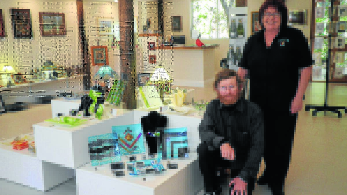 NEW ATTRACTION: Mark and Linda Floyd in their new glassware gallery at 
Nundle.