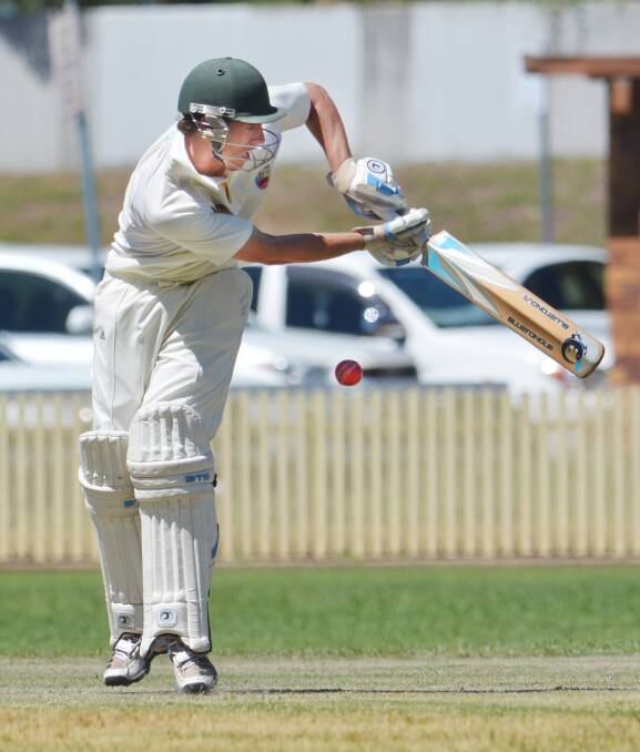Young wicketkeeper Matt Everett ha a big assignment with the batting and wicketkeeping gloves. Photo: Barry Smith. 141214BSB29