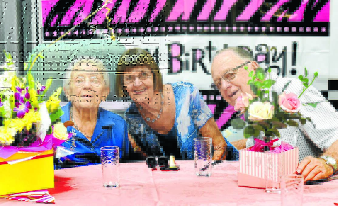 TIMELY ADVICE: Birthday girl Kath Jones, who turned 105 yesterday, with her daughter Jan Cameron, who lives in Newcastle, and son Gordon Arnold, who lives at Tweed Heads. Photo: Geoff O’Neill 250315GOE01