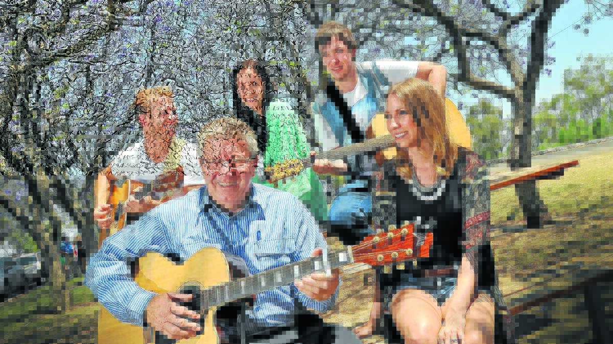 HOT COUNTRY: Tamworth mayor Col Murray was in tune with country artists Kaylee Harrison in front, with Jared Porter, Kaylee Bell and Glen Harrison at the back as they launched the 2015 Tamworth Country Music Festival. 141114GGA02