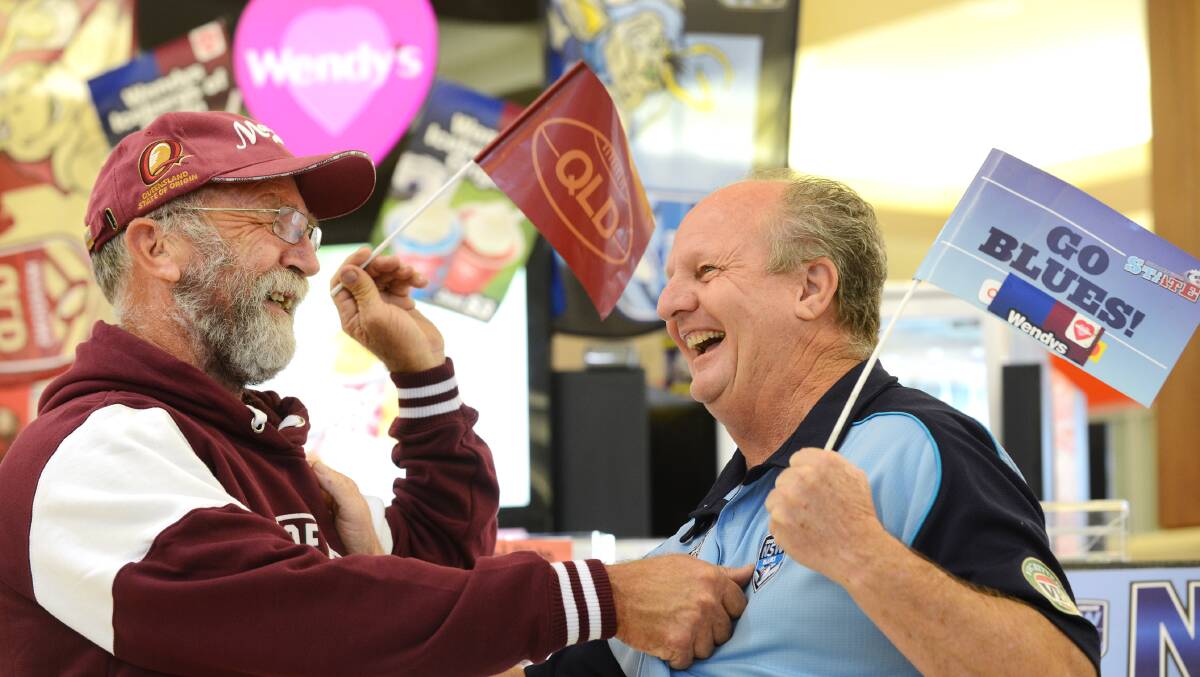 MATE AGAINST MATE: Good friends Geoff Watson and Lester Solomons have made a hair-raising bet over this year’s State of Origin series.
Photo: Barry Smith 270514BSB08