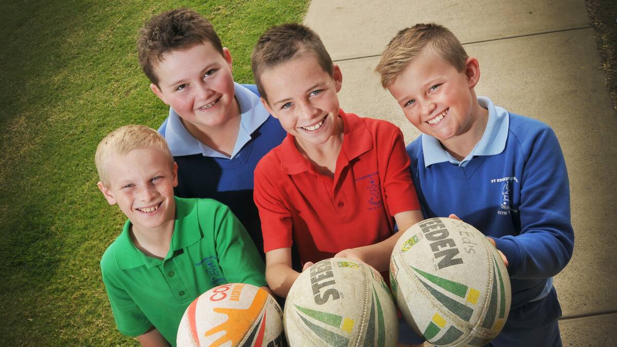 St Eds students and footy fans (from left) Blake Ginman, Mitch Ebert, Liam Ball and Kyle Short have been thinking about today’s  Peel Schools Carnival all term and can’t wait to hit the field today. Six sides from St Ed’s are itching to get into this year’s carnival  after last year’s was rained out. St Ed’s have won the Most Successful School trophy for the past three carnivals and are looking to put another one in the cabinet this year. They will have to compete against almost 50 other school teams from around the region in the 66th year of the prestigious event. More Peel Schools and a huge weekend of rugby league action on page 110. 
Photo: Gareth Gardner 130614GGC01