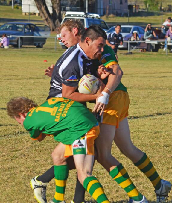 Mitch Campbell puts the shoulder into hard running Werris Creek centre Peter Johnson on Saturday who scored one and set another up in the 30-20 point win over Boggabri. Photo: Chris Bath 160515CBA