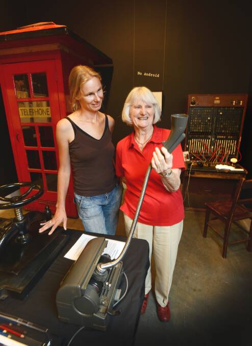 STEP BACK IN TIME: Esther Tenbrink, from Deepwater, and Nola Clare, from Armidale, investigate the once very common office staple, the dictaphone. Photo: Barry Smith 030414BSD03