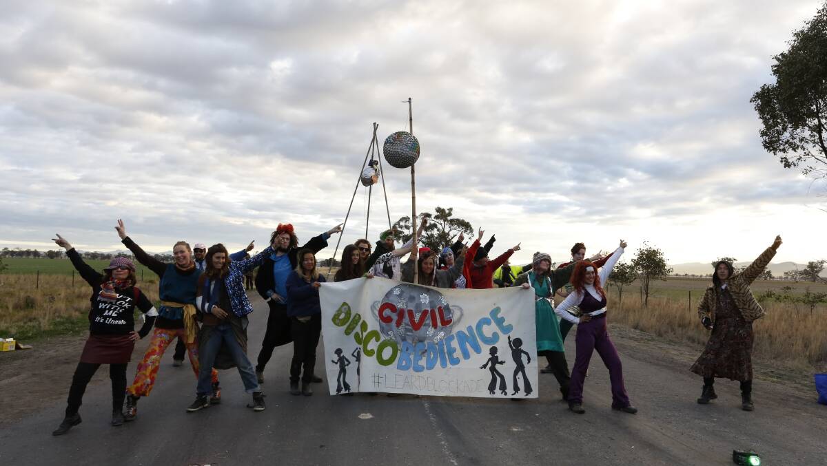 LET'S DANCE: Environmental activists gather for a disco-themed protest action against Whitehaven Coal's mine at Maules Creek, near Boggabri, yesterday.