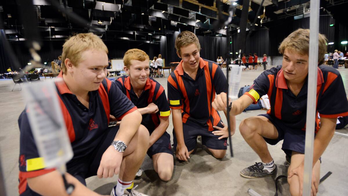 DRIP, DRIP: From left, Calrossy Anglican School secondary boys’ students Matthew Kelly, Josh Fitzgerald, Cooper McCormack and Sam Orman investigate the flow of water in the science and engineering challenge. 190314GGB10