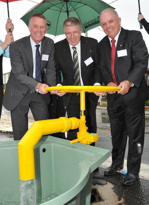 CO-OPERATION THE KEY: Three tiers of government – NSW Deputy Premier Andrew Stoner, Tamworth mayor Col Murray and Nationals Senator John Williams turn on the tap, ensuring Barraba’s water security. 
Photo: Geoff O’Neill 300414GOB16