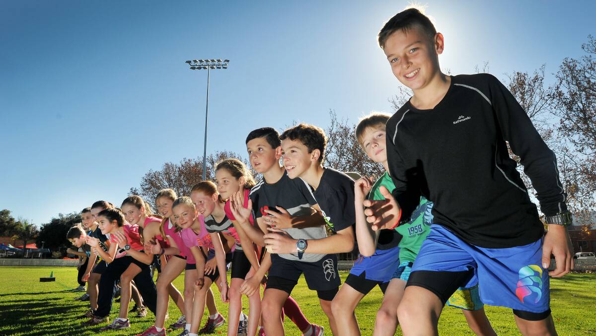 Preparing for today’s North West Schools Sports Association regional cross-country championships are (from right) Fletcher Partlin, Hunter Hall, Lachlan Wesierski, Logan Spinns and  Emily Deasey with several of their fellow competitors.  Photo: Gareth Gardner  090614GGA03