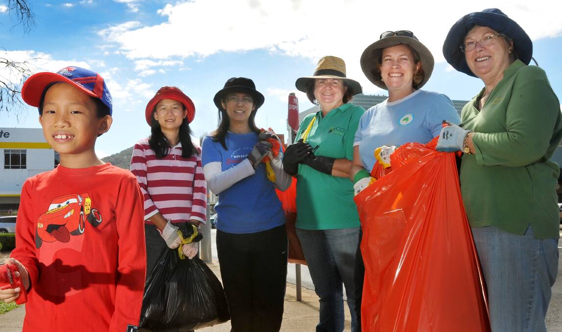 CLEANEST CLEAN UP: Michelle Wong, Jasimin Lee, Julie Clancy, Stephanie Cameron, Jean Coady, and Gavril Tan in front, had to scour the area for rubbish. Photo: Gareth Gardner 020214GGC03