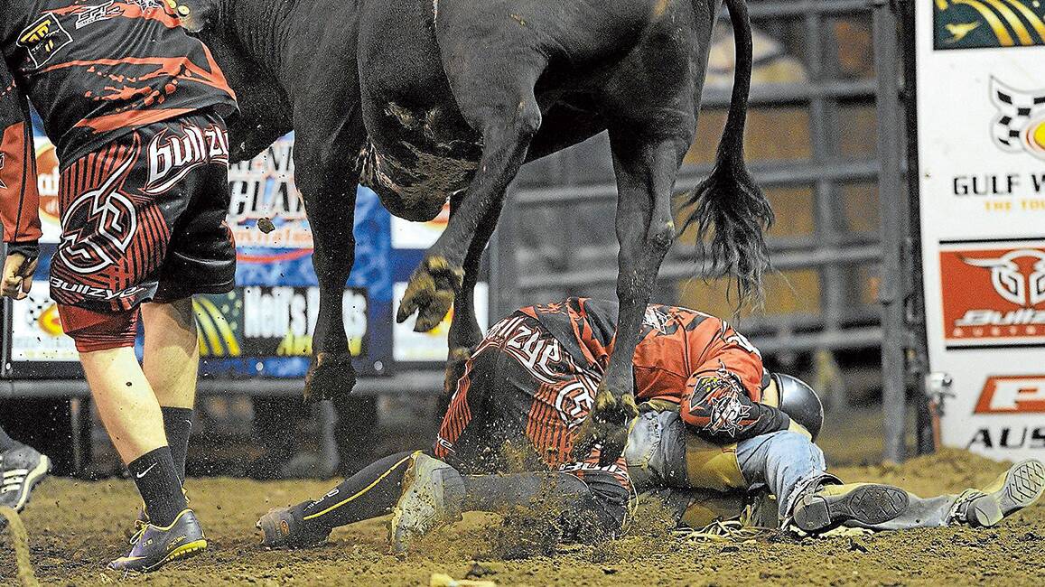 LIFESAVER: Rodeo clown Lincoln Brown throws his body on the line to protect his mate.