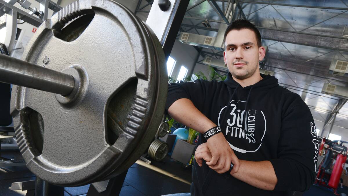 FLEX FOR SUCCESS: Tamworth’s Eli Latsinos says the sport of strongman is not for the faint-hearted. Photo: Barry Smith 130514BSC03