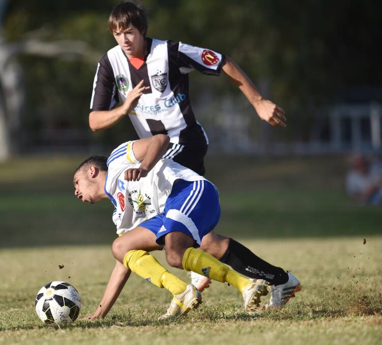 North Companions central defender Will Howard covers his Moree FC opponent in last Saturday’s 9-nil win.  Photo: Barry Smith 160515BSH13