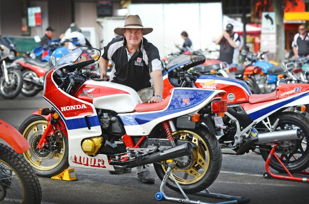 GEARED UP FOR GOOD CAUSE: Motorbike aficionado Gary Burgess proudly displays one of his beloved Hondas at the weekend’s Vintage Japanese Motorcycle Club ride and show day in Tamworth. The event raised $1650 for research into prostate cancer. Photo: Barry Smith 210914BSA04