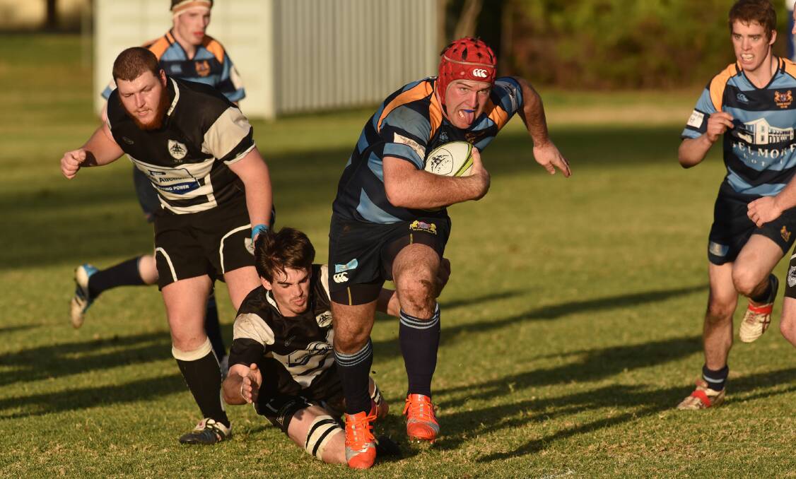 Tamworth breakaway Nathaniel Ellerton launches a desperate attempt to stop Scone breakaway Paul McTaggart during Saturday’s clash as prop Rory Marshman follows proceedings. Photo: Geoff O’Neill 230515GOG05