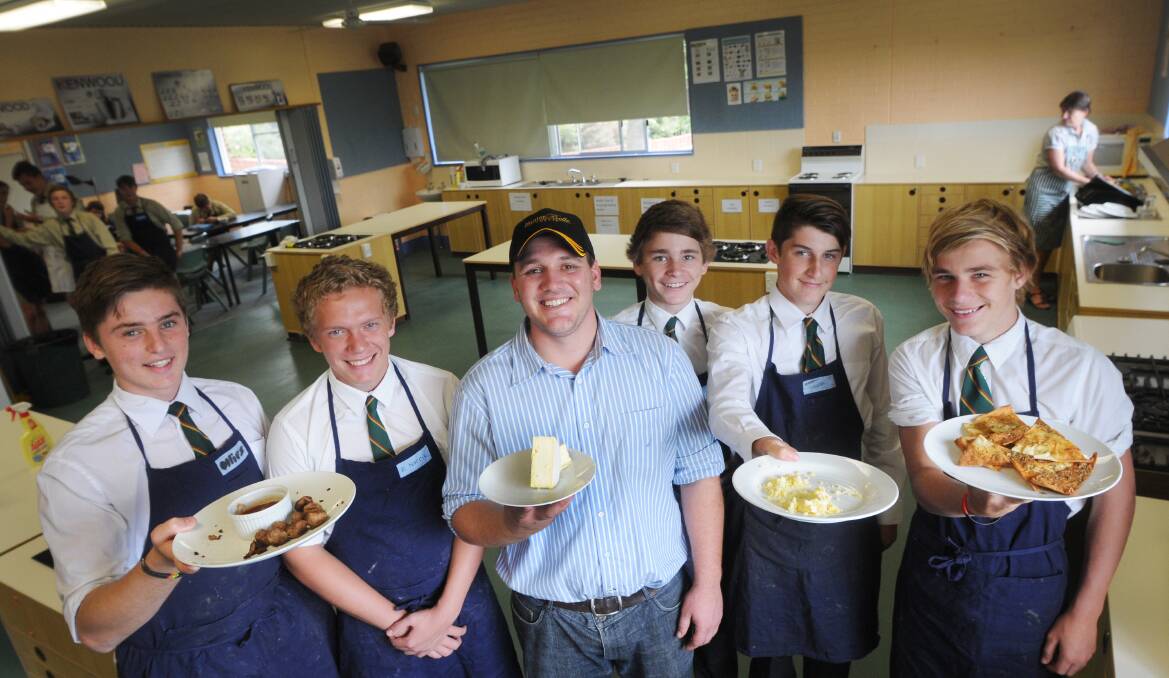 CLEVER COOKS: Farrer Memorial Agricultural High School students, Konnah Dixon, Paul Norrie, Tim Quirk, Logan Chown and Angus Houlahan cooked with MKR star Jason Chesworth yesterday. Photo: Gareth Gardner 100414GGC09
